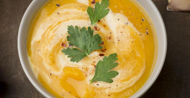 bowl of soup with herbs