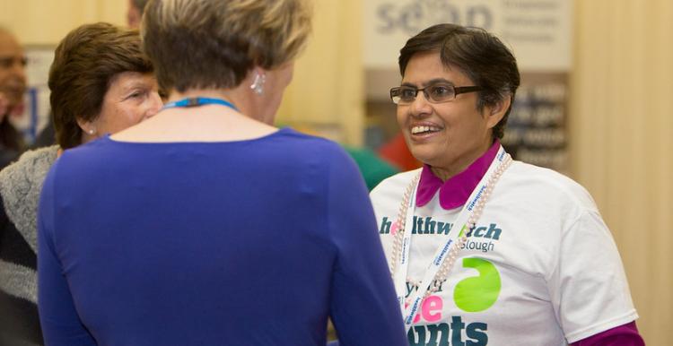 Healthwatch volunteer talking to a woman