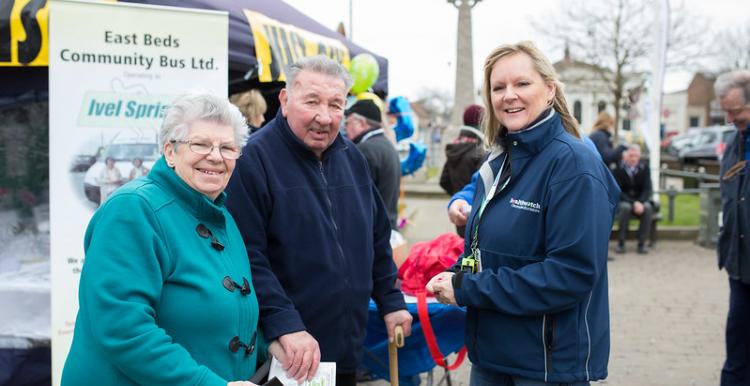 Healthwatch volunteer talking to two members of the public