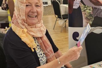 lady looking at a lealfet