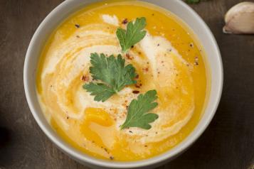 bowl of soup with herbs