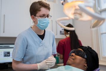 dentist about to operate on a patient, NHS dentist, dentistry, dental appointment