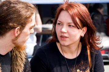 Young woman mid conversation with a young man